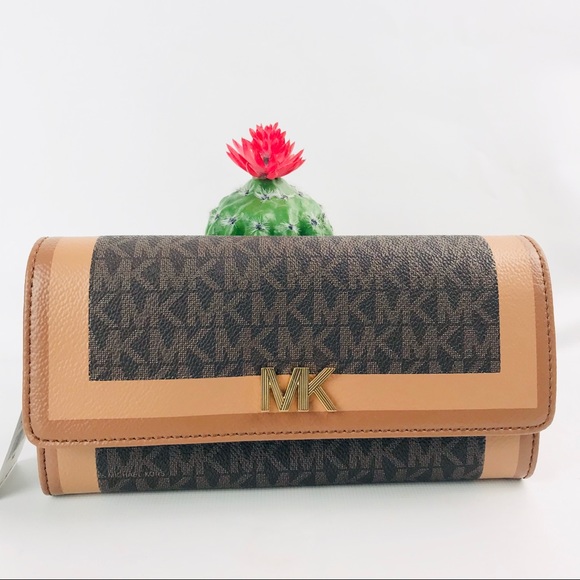 Michael Kors Handbags - Authentic Michael Kors Montgomery LongFlip Wallet